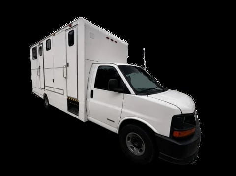 White pickup truck with attached camper box on black background