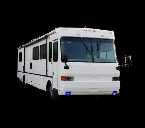 White recreational motorhome with multiple windows and slide-out section photographed against black background