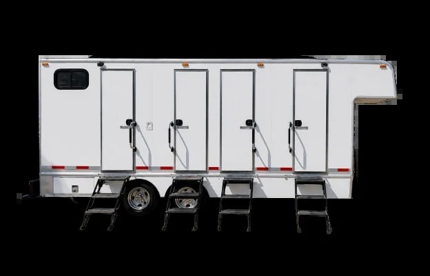 White mobile restroom trailer with four stalls and pull-down steps, viewed from the side