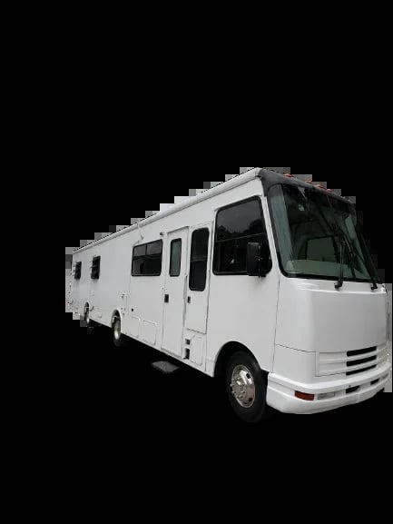 White recreational motorhome with multiple windows and side view angle against black background